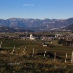 Asiago plateau seen from east in the foreground feature palisade country setting, at the center the ossuary, the background Tonezza right and the massif of Pasubio left. Veneto Italy.