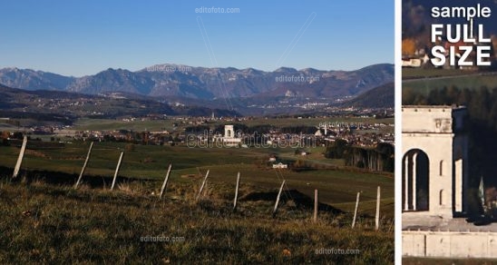Asiago plateau seen from east in the foreground feature palisade country setting, at the center the ossuary, the background Tonezza right and the massif of Pasubio left. Veneto Italy.