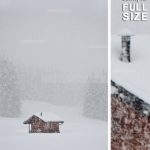 Asiago Plateau Hut during a snowfall. bewitching winter landscape.
