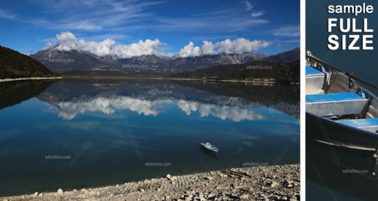 Lago di Santa Croce è un lago naturale situato in provincia di Belluno, nella zona dell'Alpago, al confine con la provincia di Treviso. Sullo sfondo tra le nubi a sinistra il monte Dolada a destra il Teverone e Col Nudo.